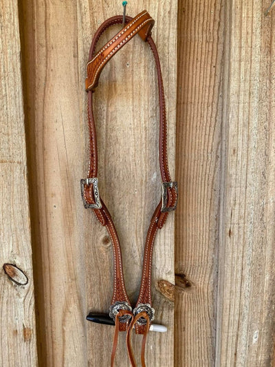 Western Bridle One Ear Tan leather headstall with basket weave tooling.